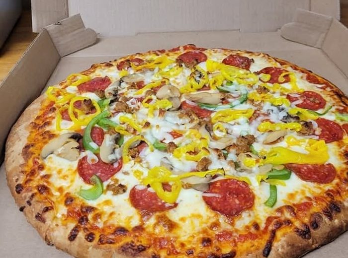 A loaded pizza from a local restaurant near State Line Campground.